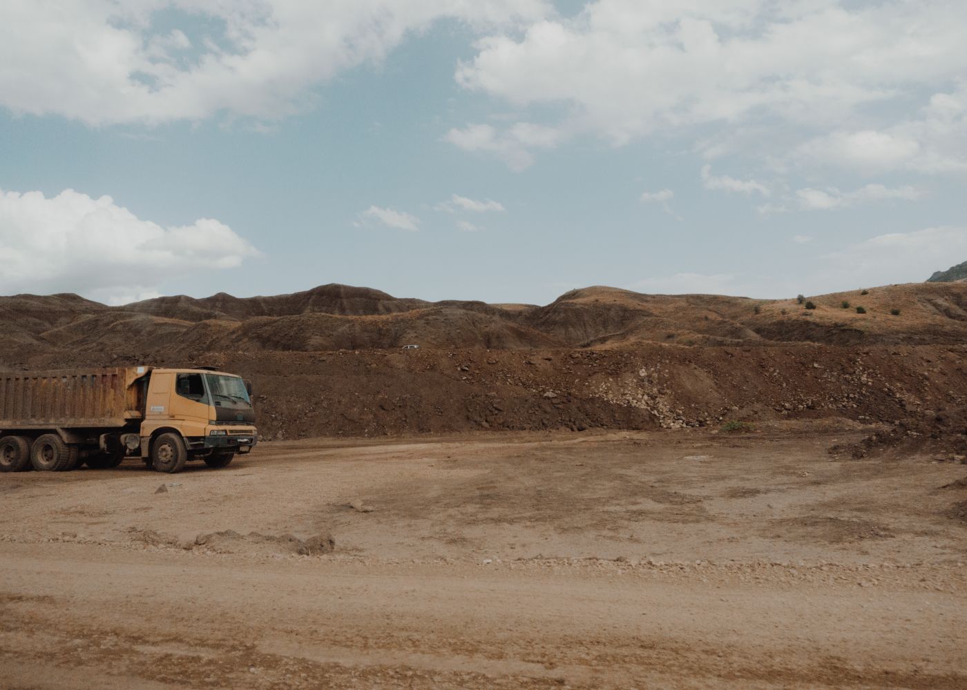Used dump truck evaluation: dump truck at a quarry. Illustrative stock photo.