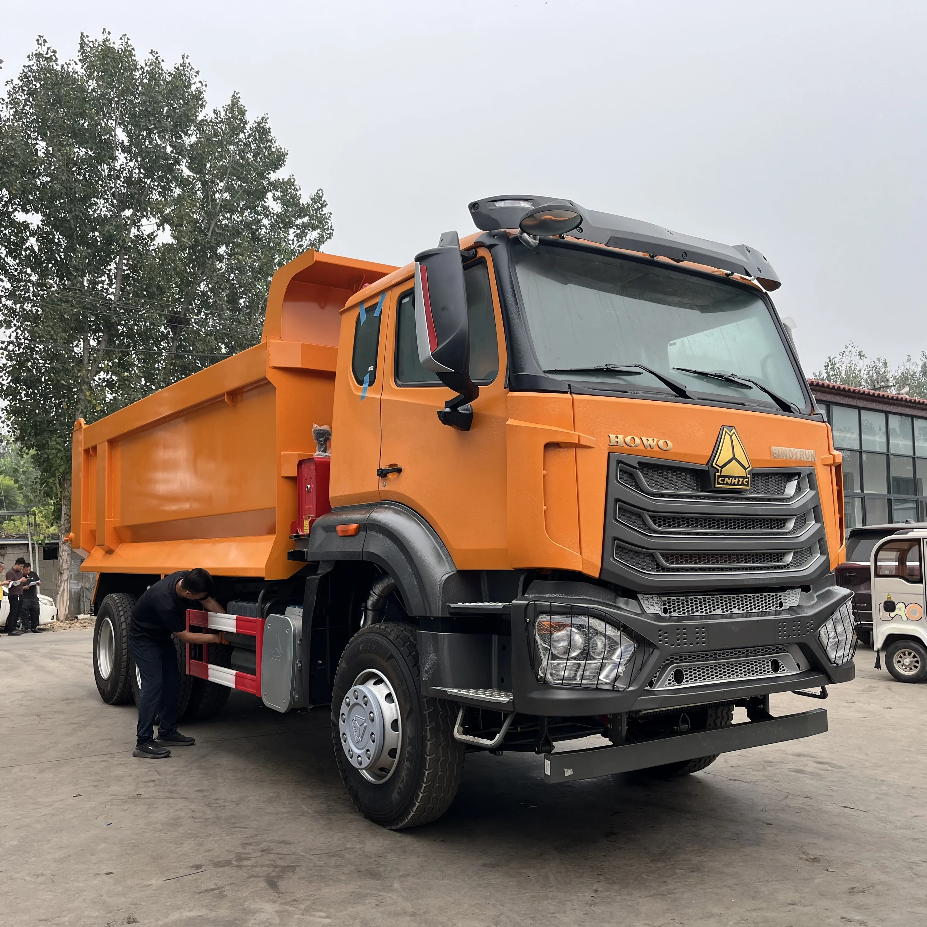 Orange HOWO NX 6×4 dump truck
